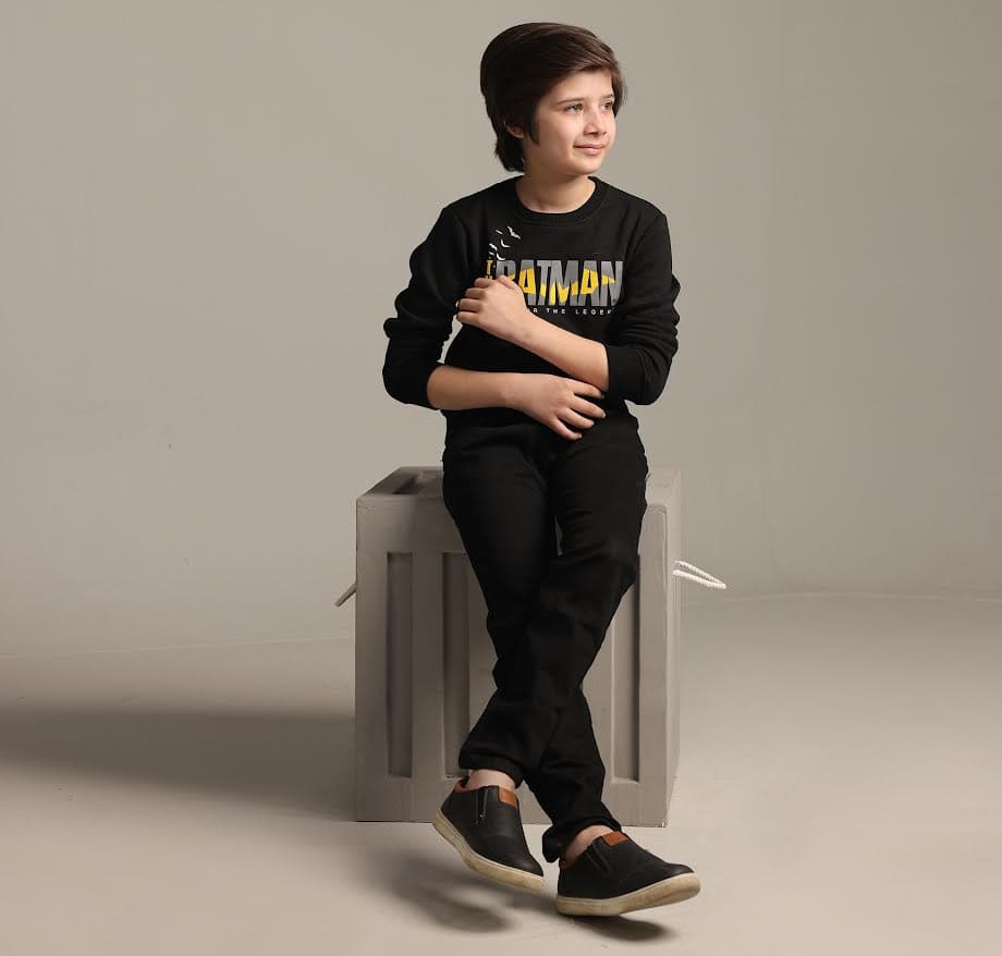 Community member in a black hoodie portrait